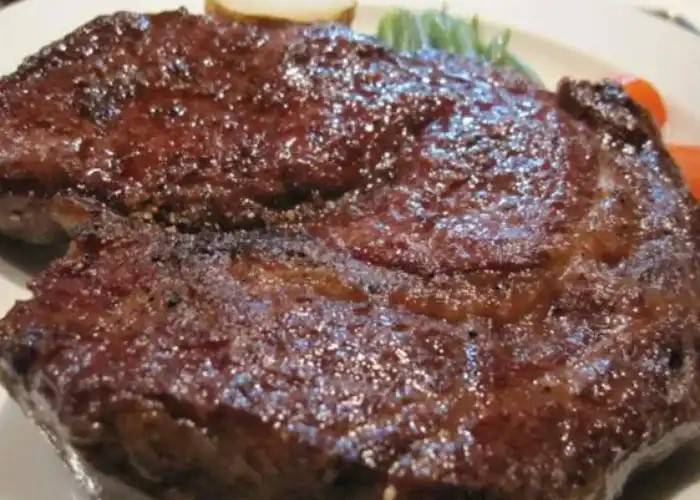 A close-up of a cooked wagyu beef steak.